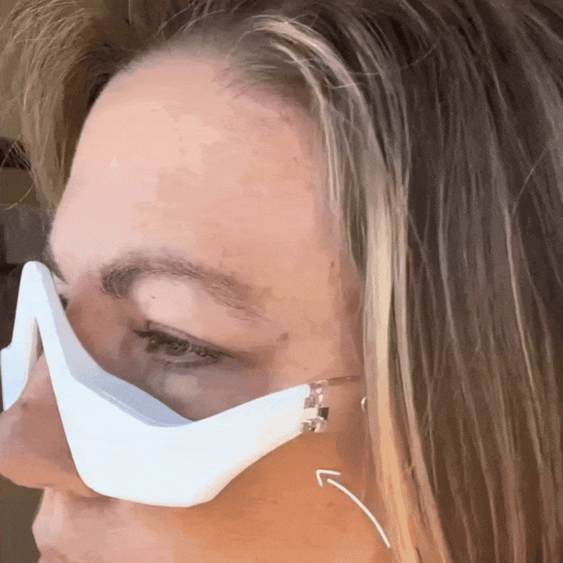 Lady using RevitalEyes™ 2-in-1 Red Light + EMS Under-Eye Therapy
