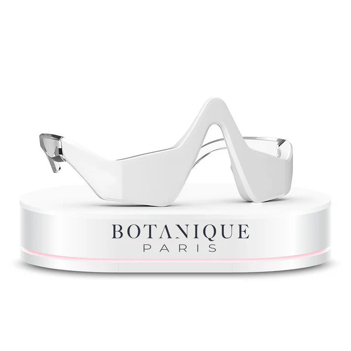 White eye mask on a white stand with 'Botanique Paris' branding