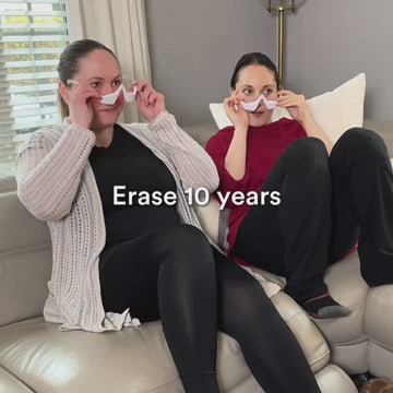 Two women wearing RevitalEyes under-eye therapy masks
