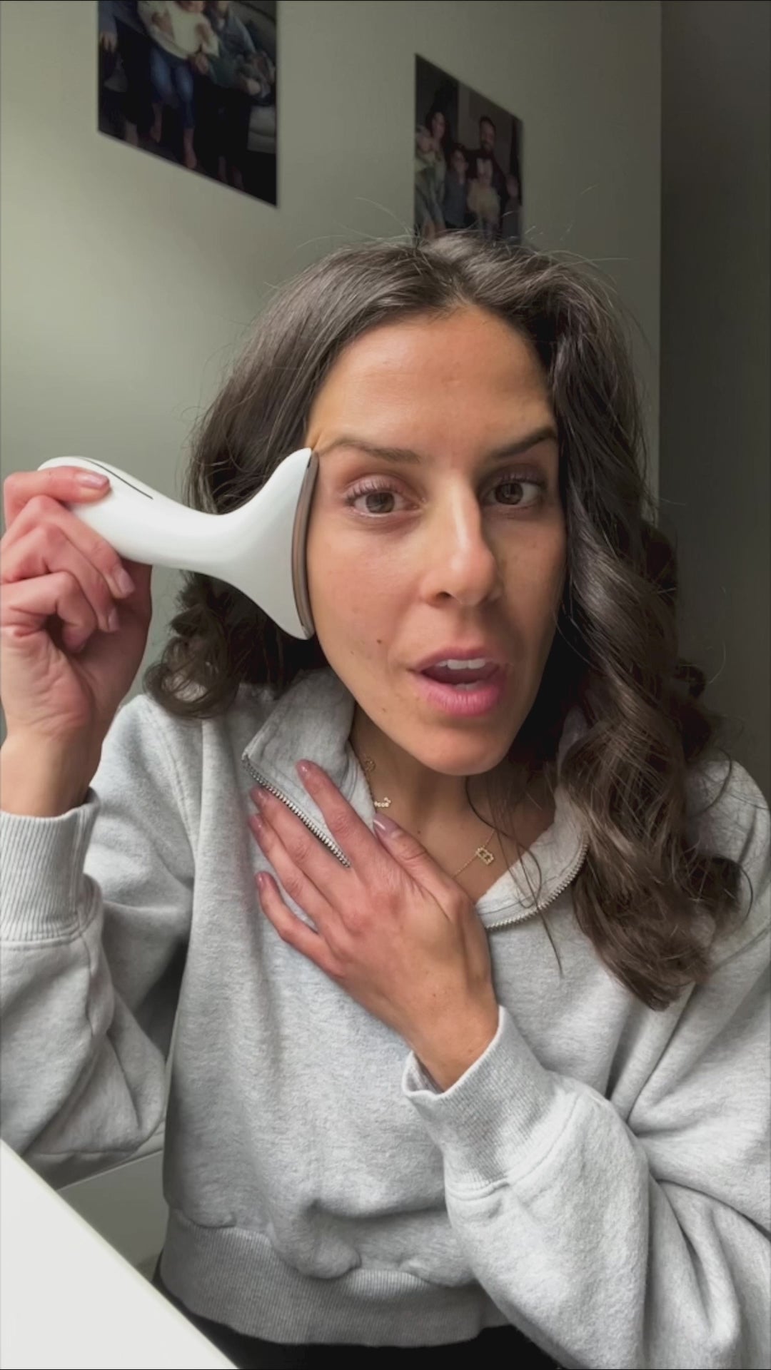 Woman demonstrating how to use LED light therapy device